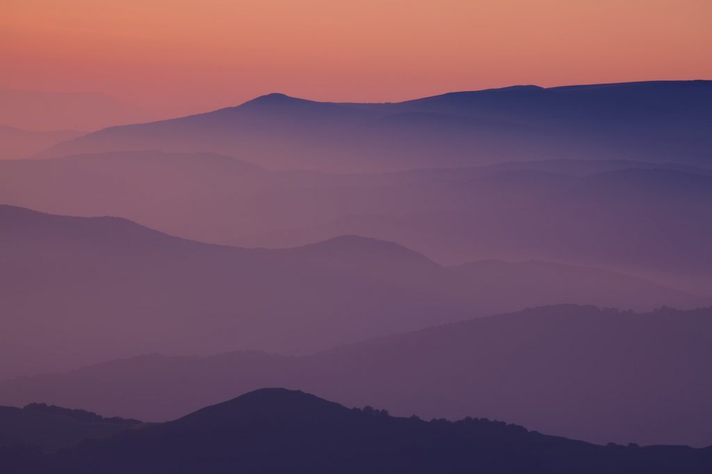 Silhouettes of the mountain hills at sunset