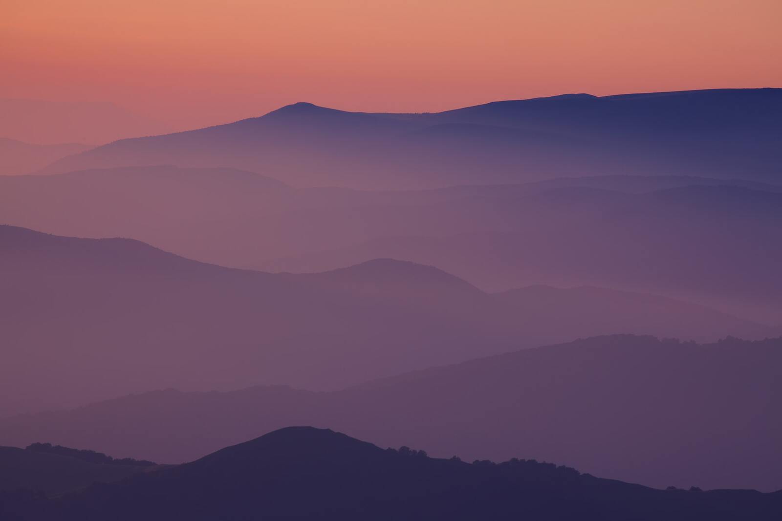 Silhouettes of the mountain hills at sunset