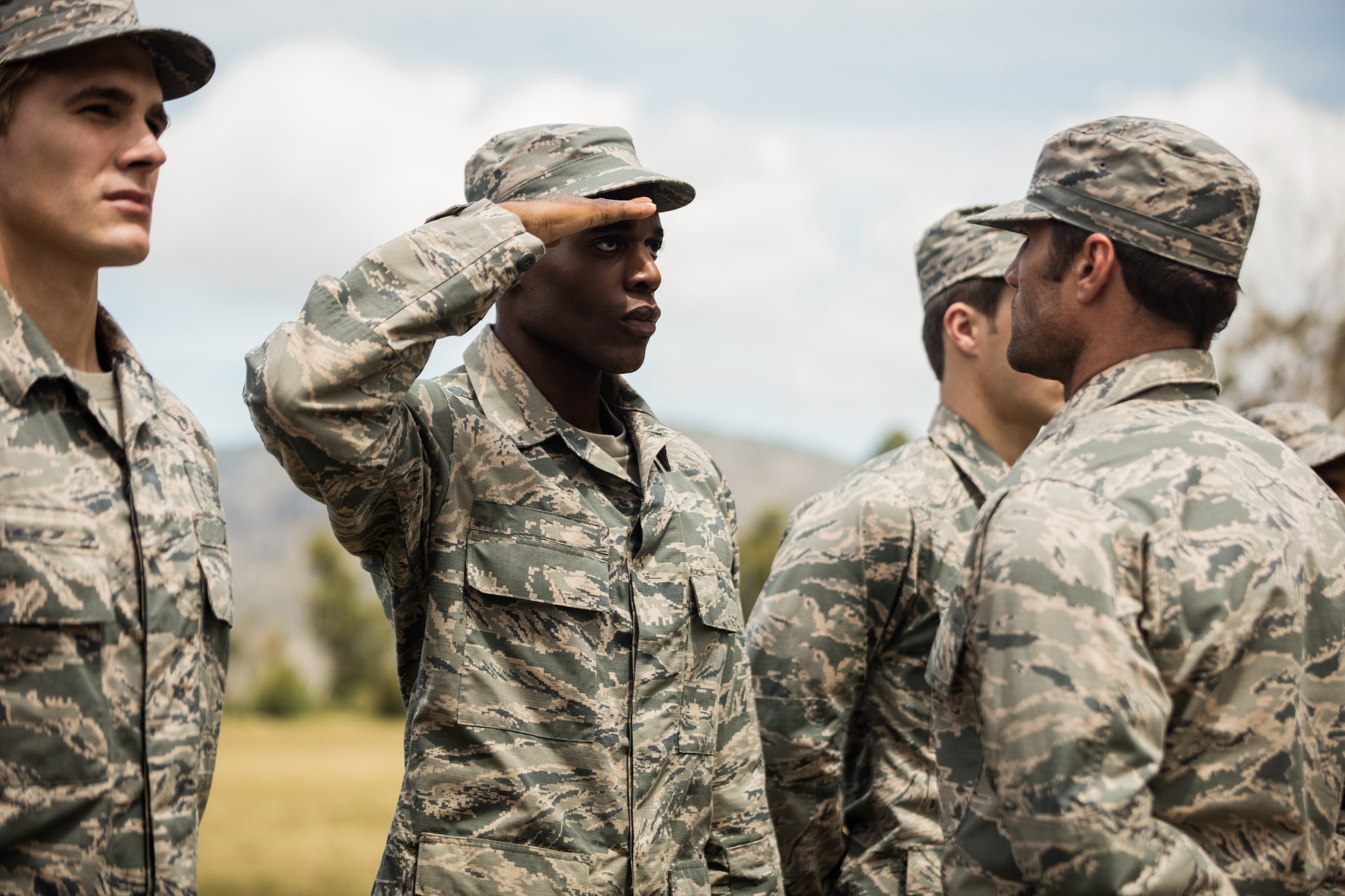 Military trainer giving training to military soldier