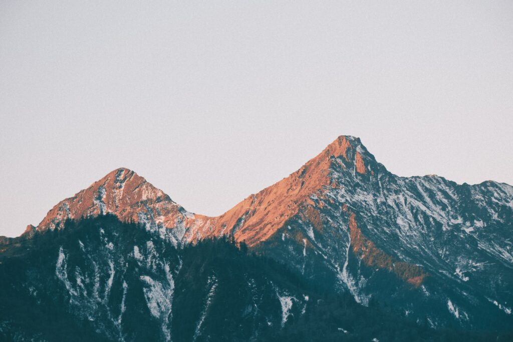 brown mountains under white sky